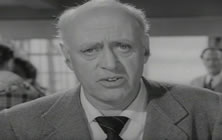 Alastair Sim as Stephen Potter addresses the film audience